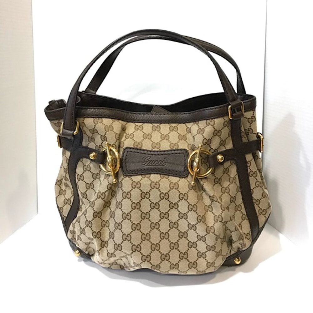 Gucci GG monogrammed canvas and leather handbag